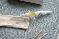 Bare Hands product with applicator and cleaning cloth on a textured surface