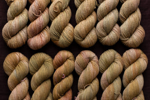 gold row of yarn hanks