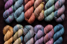 Load image into Gallery viewer, multi-color row of yarn hanks