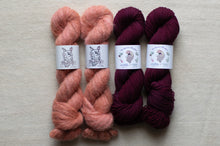 Load image into Gallery viewer, Four skeins of yarn in pink and purple on a light gray background