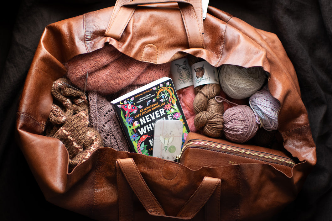 re:designed project bag with knitting materials and book