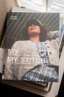 Book titled 'My City My Stitches' by Jenny Ansaah on a surface with a blurred background.