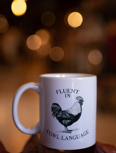 fluent in fowl language coffee mug