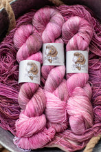 Load image into Gallery viewer, Three skeins of pink yarn with &#39;Fox Lady&#39; labels in a basket.