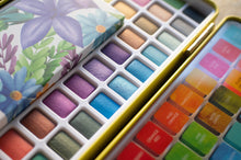 Load image into Gallery viewer, Colorful watercolor palette with a floral design on the lid
