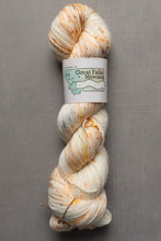 Load image into Gallery viewer, Yarn skein with a label on a gray background