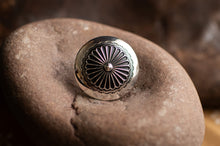 Load image into Gallery viewer, Silver decorative button on a textured stone surface