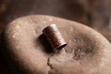 Load image into Gallery viewer, Decorative copper ring on a stone surface