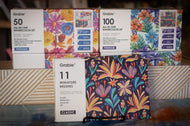 Grabie watercolor sets with floral designs on boxes