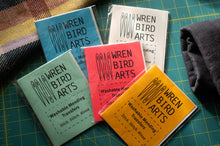 Load image into Gallery viewer, Collection of Wren Bird Arts products on a green cutting mat.