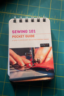 Sewing 101 pocket guide on a green cutting mat