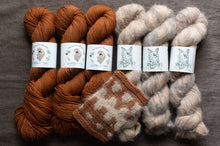 Load image into Gallery viewer, Three skeins of brown yarn and three skeins of gray yarn with matching knitted swatches on a wooden surface.