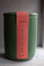 Load image into Gallery viewer, Green jar with a red label on a wooden surface