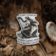 Mermaid sticker with text on a wooden surface