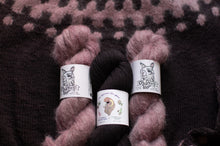 Load image into Gallery viewer, Three skeins of yarn with labels on a textured fabric background