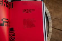 Load image into Gallery viewer, Open book showing a page titled 'Knitwear Styles' with red cover and black text.