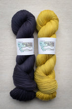 Load image into Gallery viewer, Two skeins of yarn, one dark blue and one yellow, with &#39;Great Falls Montana&#39; labels on a beige background.