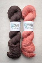 Load image into Gallery viewer, Two skeins of yarn, one brown and one pink, with &#39;Great Falls, Montana&#39; labels on a light gray background.