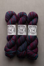 Load image into Gallery viewer, Three skeins of variegated yarn with white paper labels reading 'Dream State Spincycle Yarns' arranged side by side on a neutral gray background.
