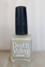 Load image into Gallery viewer, Nail polish bottle with &#39;Death Valley Nails&#39; label on a wooden surface.
