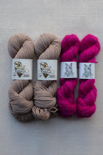Load image into Gallery viewer, Four skeins of yarn arranged side by side on a light gray textured background. The left two skeins are a muted taupe-beige, and the right two skeins are a vivid hot pink.