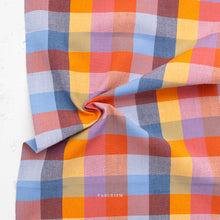 Load image into Gallery viewer, Multicolored checkered fabric with 'Fableism' branding on a white background