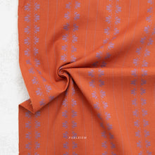 Load image into Gallery viewer, Orange fabric with printed text on a white background