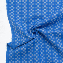 Load image into Gallery viewer, Blue fabric with a subtle pattern on a white background