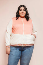 Load image into Gallery viewer, Person wearing a two-tone jacket with a pink and white design on a plain background