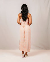 Load image into Gallery viewer, Woman wearing a pink floral dress against a plain background