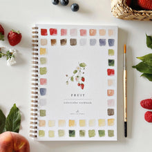 Load image into Gallery viewer, Watercolor workbook titled 'Fruit' with a pen and fruits on a white surface