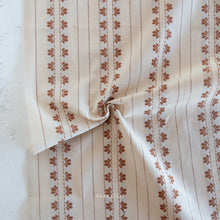 Load image into Gallery viewer, Beige fabric with brown floral patterns on a white background