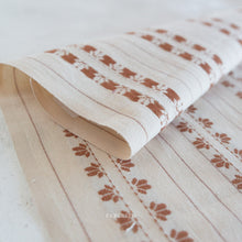 Load image into Gallery viewer, Fabric with brown floral pattern on a white background, featuring the brand 'Fableish'.