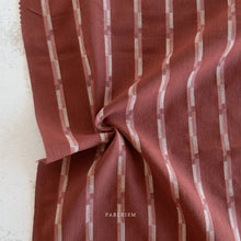 Load image into Gallery viewer, Close-up of red and white striped fabric with 'FABEEISM' branding.