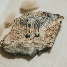 Load image into Gallery viewer, Pair of earrings on a textured stone surface