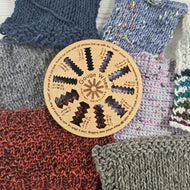 Wooden gauge wheel with knitted fabric background