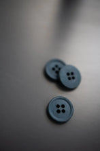 Load image into Gallery viewer, Two blue buttons on a gray surface