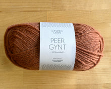 Load image into Gallery viewer, Ball of yarn with a label on a wooden surface