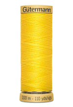 Load image into Gallery viewer, Spool of yellow Gutermann thread on a white background
