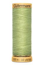 Load image into Gallery viewer, Green spool of Gutermann thread on a white background