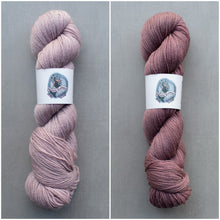 Load image into Gallery viewer, Two skeins of pink yarn with labels on a gray background