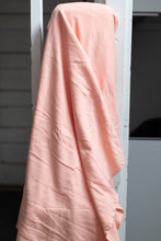 Load image into Gallery viewer, Pink fabric draped over a white door frame