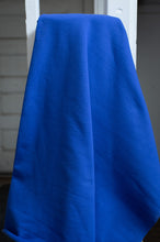 Load image into Gallery viewer, Blue fabric draped over a white frame with a neutral background