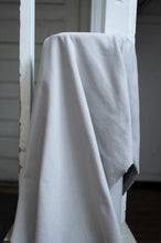 Load image into Gallery viewer, White fabric draped over a white chair with a neutral background