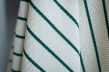 Load image into Gallery viewer, Close-up of a fabric with green stripes on a neutral background