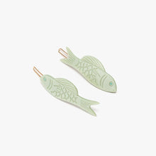 Load image into Gallery viewer, Pair of green fish-shaped hair clips on a white background