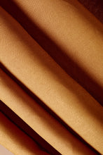 Load image into Gallery viewer, Close-up of brown fabric with folds