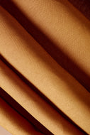 Close-up of brown fabric with folds
