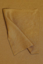 Load image into Gallery viewer, Folded brown fabric on a matching background