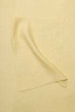 Load image into Gallery viewer, Folded light yellow fabric on a matching background